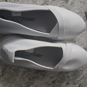 Puma Women's White And Black Slip-On Sneakers